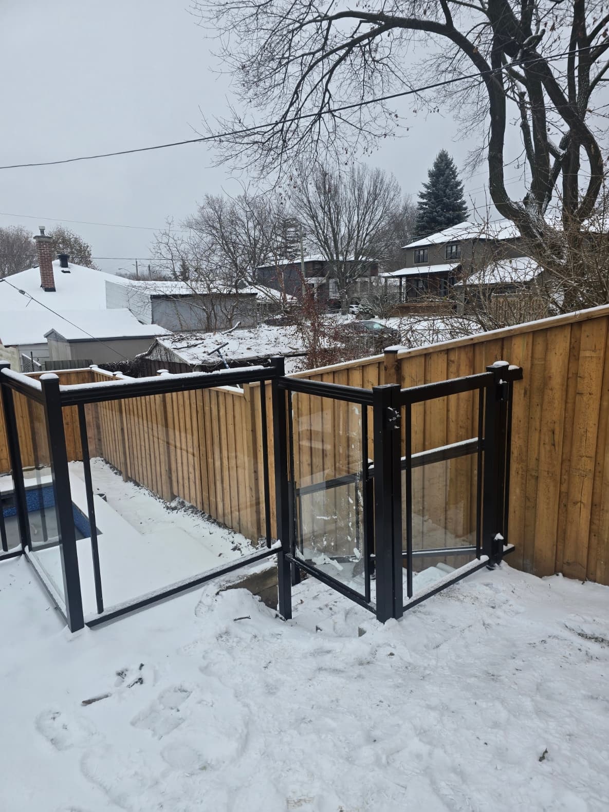 Standoff mounted framed glass railing on exterior steps