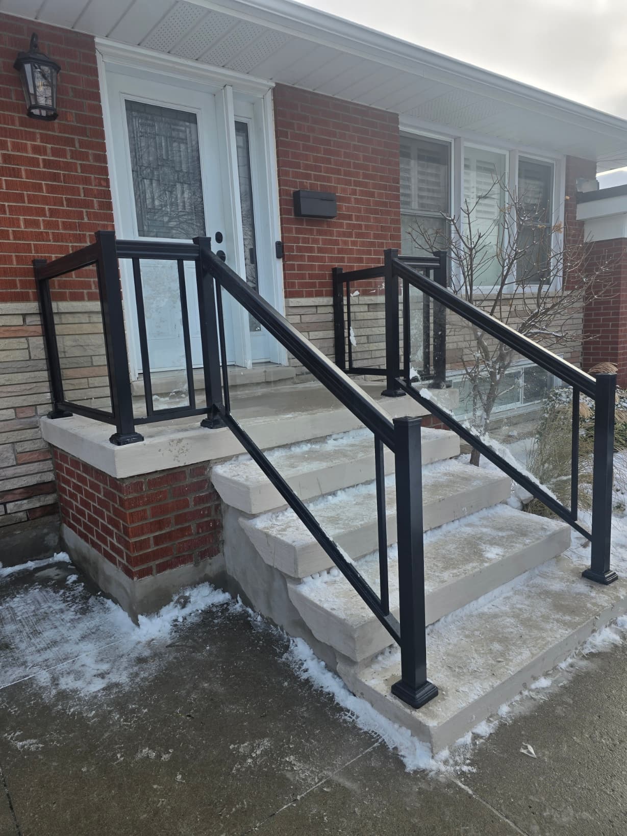 Clamp held framed glass railing on a residential balcony