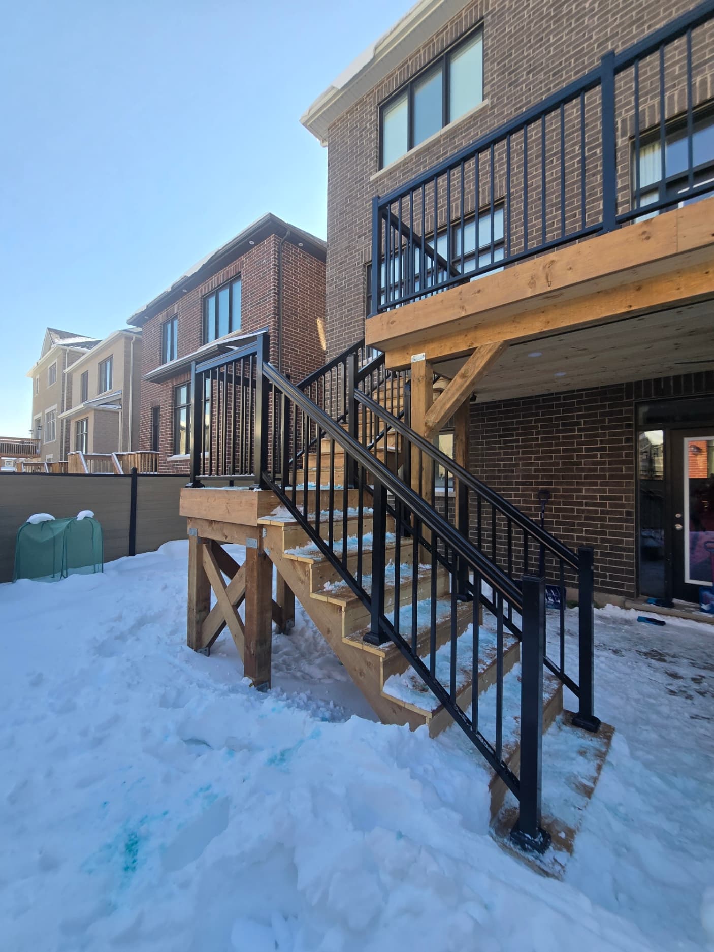 Aluminum picket railing on a raised porch in the GTA