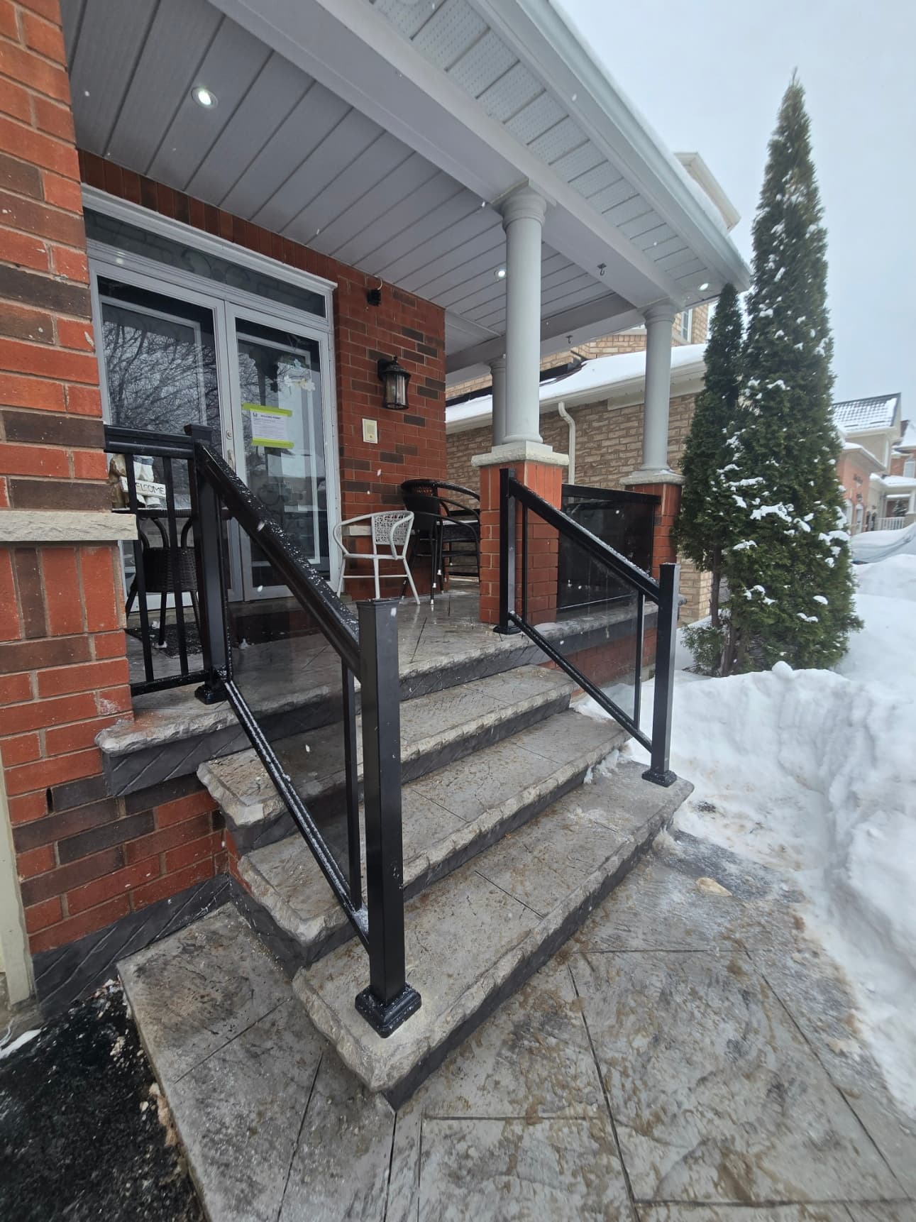 Framed glass railing on deck