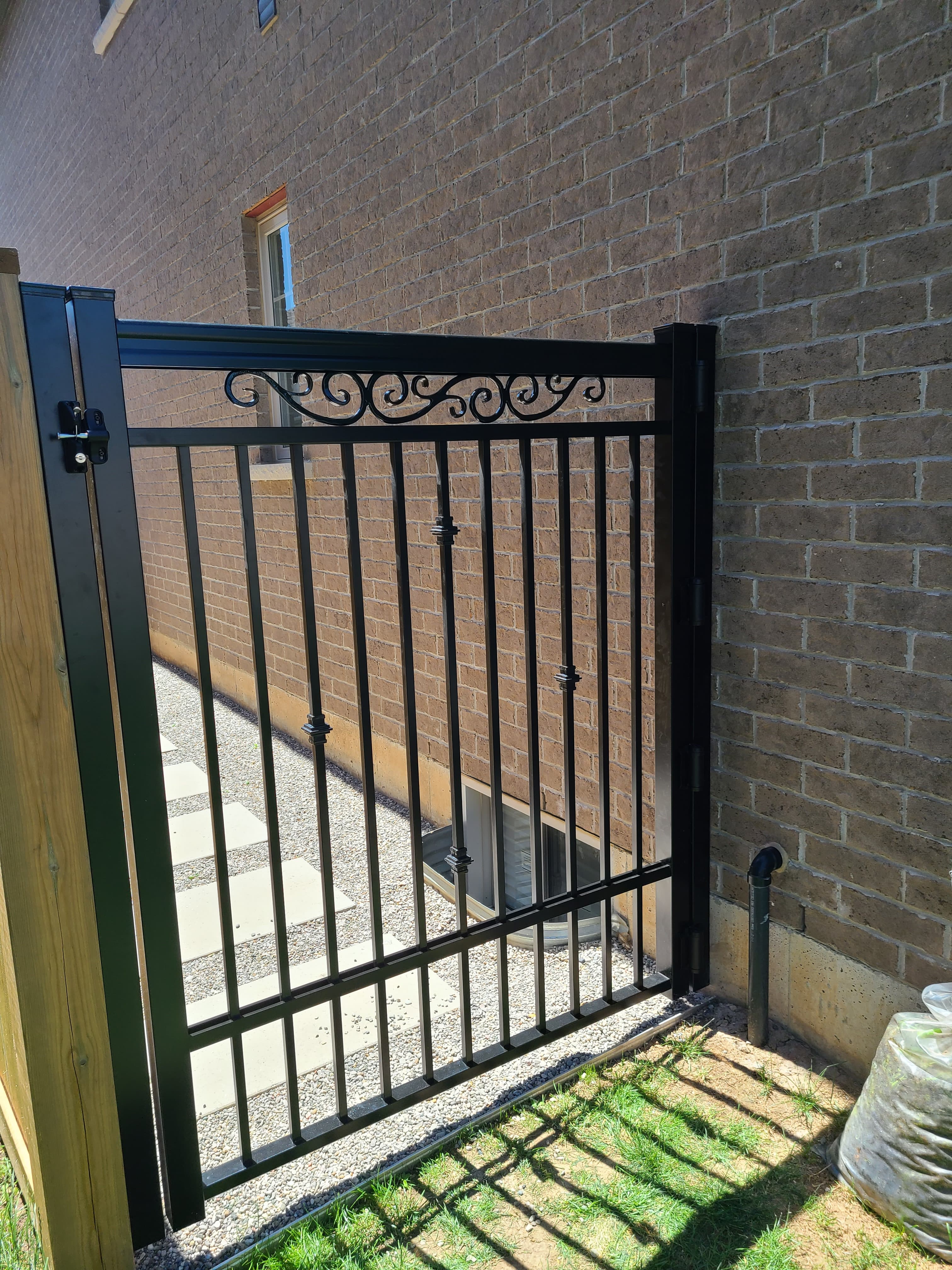Custom aluminum gate with decorative scrollwork
