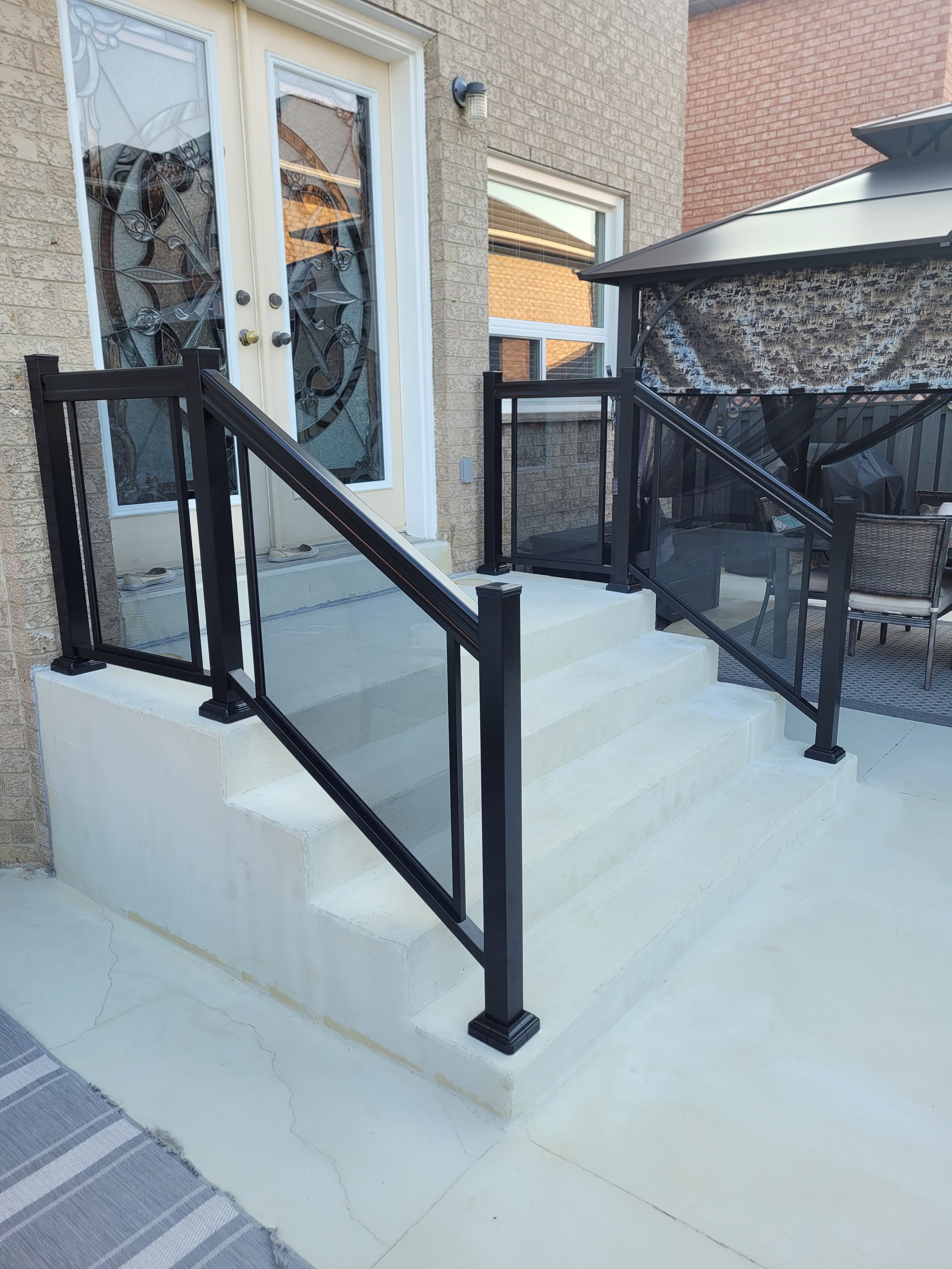 Frameless glass railing on exterior stairs