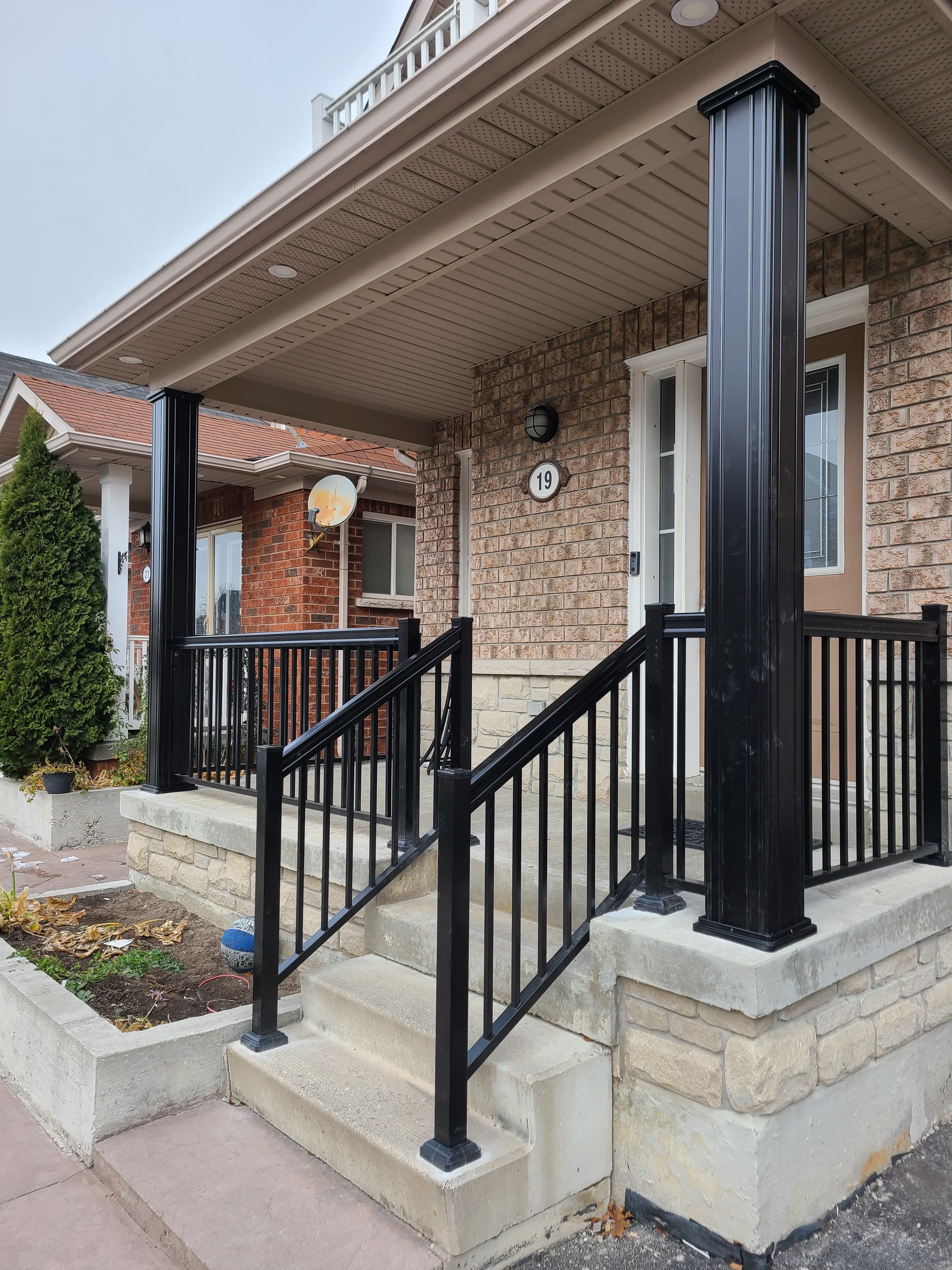 Aluminum porch columns paired with matching railings